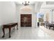 Elegant foyer with soaring ceilings, dark wood doors, and white tile flooring at 28451 Great Bend Pl, Wesley Chapel, FL 33543