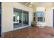 Covered patio with tile flooring, a ceiling fan, a large sliding glass door and view of the screened-in pool at 28451 Great Bend Pl, Wesley Chapel, FL 33543