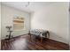 This room features wood laminate flooring and a large window providing natural light at 28451 Great Bend Pl, Wesley Chapel, FL 33543