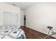 Cozy room with wood laminate flooring, white walls and a closet with sliding doors at 28451 Great Bend Pl, Wesley Chapel, FL 33543