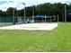 Outdoor sand volleyball court, perfect for recreation and fitness, with viewing benches and green space at 28451 Great Bend Pl, Wesley Chapel, FL 33543