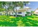 Charming single story condo, featuring a lush green lawn with mature trees at 2933 Bough Ave # C, Clearwater, FL 33760