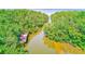 Scenic waterway surrounded by lush mangroves, leading towards a bridge and distant cityscape at 2933 Bough Ave # C, Clearwater, FL 33760