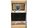 Bathroom features a large vanity with marble countertop, dark cabinets and drawers, and chrome fixtures at 3062 Eastland Blvd # 105, Clearwater, FL 33761