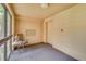 Cozy elevator lobby with a comfortable chair near the windows, providing a welcoming space for residents at 3062 Eastland Blvd # 105, Clearwater, FL 33761