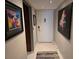 Inviting entryway featuring neutral walls and striking artwork, setting a welcoming tone to the home at 3062 Eastland Blvd # 105, Clearwater, FL 33761