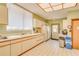 Functional community kitchen featuring ample counter space, cabinets, and essential appliances at 3062 Eastland Blvd # 105, Clearwater, FL 33761