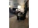 Cozy living room featuring a sofa, side tables and large windows at 3062 Eastland Blvd # 105, Clearwater, FL 33761