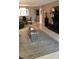 Inviting living room with a modern coffee table and elegant chandelier at 3062 Eastland Blvd # 105, Clearwater, FL 33761