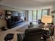 Relaxing living room with balcony access offering scenic views and ample natural light at 3062 Eastland Blvd # 105, Clearwater, FL 33761