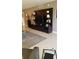 Spacious living room featuring a stylish entertainment center and neutral color palette at 3062 Eastland Blvd # 105, Clearwater, FL 33761