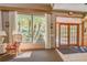 Well-lit lobby with view of tropical foliage, offering an inviting entry to the building at 3062 Eastland Blvd # 105, Clearwater, FL 33761