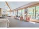 Spacious community lobby featuring large windows, comfortable seating, and a fireplace at 3062 Eastland Blvd # 105, Clearwater, FL 33761