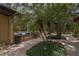 Beautiful community pool area surrounded by lush landscaping and mature palm trees at 3062 Eastland Blvd # 105, Clearwater, FL 33761