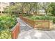 Scenic walkway over a lush garden, providing a peaceful and inviting atmosphere for residents at 3062 Eastland Blvd # 105, Clearwater, FL 33761