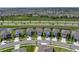 An aerial view shows this home in a community setting, positioned with easy access to the main road at 30739 Penny Surf Loop, Wesley Chapel, FL 33545