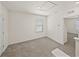 Upstairs bedroom with neutral carpet, single window, and entryway offers a calm space to relax and unwind at 30739 Penny Surf Loop, Wesley Chapel, FL 33545