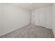 Bedroom featuring carpet, neutral walls, and multiple doorways at 30739 Penny Surf Loop, Wesley Chapel, FL 33545