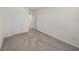 Bedroom with carpet, a window, and neutral walls with white trim at 30739 Penny Surf Loop, Wesley Chapel, FL 33545