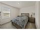 Bedroom with carpet, a window with blinds, and gray furniture at 30739 Penny Surf Loop, Wesley Chapel, FL 33545
