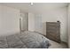 Bedroom with carpet, a window, grey furniture and neutral walls at 30739 Penny Surf Loop, Wesley Chapel, FL 33545
