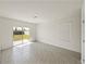 Bright, airy living room featuring large sliding glass doors and natural light at 30739 Penny Surf Loop, Wesley Chapel, FL 33545
