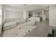 Open living area boasts neutral decor and flows seamlessly into the kitchen at 30739 Penny Surf Loop, Wesley Chapel, FL 33545