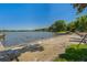 Picturesque beach area with clear water, sandy shore, and lush greenery, ideal for waterfront living at 3113 W Sligh Ave, Tampa, FL 33614