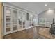 Light-filled bedroom boasts glass paneled closet doors and gray walls at 3113 W Sligh Ave, Tampa, FL 33614