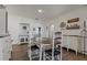 Charming dining room with white accents, wood floors and table at 3113 W Sligh Ave, Tampa, FL 33614