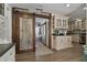 Stylish kitchen featuring stainless steel appliances, granite countertops and custom sliding door at 3113 W Sligh Ave, Tampa, FL 33614