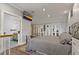 Main bedroom with a comfortable bed, closet, and bathroom. Hardwood floors and natural light provide an inviting space at 3113 W Sligh Ave, Tampa, FL 33614