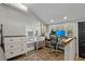 Bright office features a computer desk, chair, storage and natural light, creating an ideal workspace at 3113 W Sligh Ave, Tampa, FL 33614