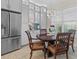 Bright dining area with decorative lighting, a round table, and built-in features providing an ideal space for Gathering meals at 31382 Chesapeake Bay Dr, Wesley Chapel, FL 33543