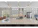 Bright, spacious kitchen with white cabinets, stainless steel appliances, and a large center island at 31382 Chesapeake Bay Dr, Wesley Chapel, FL 33543