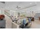 Open-concept living space with a staircase, comfortable seating, and view to the kitchen at 31382 Chesapeake Bay Dr, Wesley Chapel, FL 33543