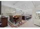 Open living space combining dining and kitchen areas with access to a sitting room at 31382 Chesapeake Bay Dr, Wesley Chapel, FL 33543