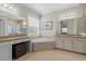 Bright main bathroom with garden tub, walk-in shower, and dual vanity sinks at 31382 Chesapeake Bay Dr, Wesley Chapel, FL 33543