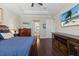 Serene bedroom with hardwood floors, a television and an ensuite bathroom at 31382 Chesapeake Bay Dr, Wesley Chapel, FL 33543