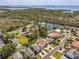Tranquil neighborhood setting with waterway access featuring lush surroundings and beautiful landscaping at 314 Crosswinds Dr, Palm Harbor, FL 34683