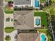 Bird's eye view featuring the property's manicured lawn and a sparkling swimming pool in the backyard at 314 Crosswinds Dr, Palm Harbor, FL 34683