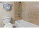 Bathroom features tiled shower and a standard bathtub and toilet at 314 Crosswinds Dr, Palm Harbor, FL 34683