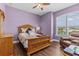 Cozy bedroom with hardwood floors, a large window, and a comfortable seating area at 314 Crosswinds Dr, Palm Harbor, FL 34683