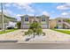 Beautiful two-story home with a charming brick driveway and manicured landscaping at 314 Crosswinds Dr, Palm Harbor, FL 34683