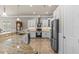 A modern kitchen has granite countertops, stainless appliances, and a breakfast bar at 314 Crosswinds Dr, Palm Harbor, FL 34683
