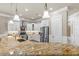 A well-equipped kitchen has granite countertops, stainless appliances and a large sink with modern faucet at 314 Crosswinds Dr, Palm Harbor, FL 34683