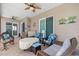 Tiled, screened-in lanai with ceiling fans and a relaxing outdoor seating area at 314 Crosswinds Dr, Palm Harbor, FL 34683