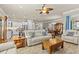An open concept living area showcases the kitchen, dining area and a comfortable seating area at 314 Crosswinds Dr, Palm Harbor, FL 34683