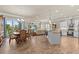 An open concept living area showcases the modern kitchen, dining area and a large entertainment center at 314 Crosswinds Dr, Palm Harbor, FL 34683