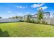 A green backyard with a white vinyl privacy fence at 33263 Sycamore Leaf Dr, Wesley Chapel, FL 33545